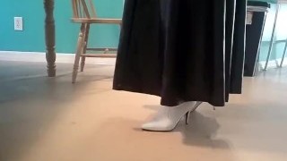 Crossdresser In White Leather Boots With Long Leather Skirt
