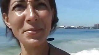 Tanned Cougar Was Picked Up On A Public Beach For Kinky Sex And A Facial