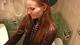 Redhead Beautiful White Girl In The Toilet Room Undresses And Pisses